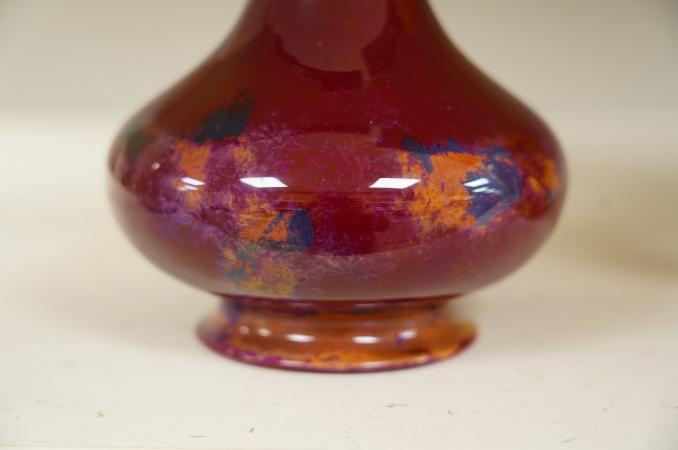 An early Royal Doulton flambé lustre bottle vase, early 20th century, 24cm high. Condition - good